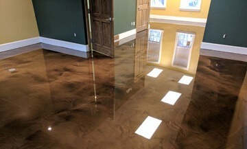 Natural toned Metallic Epoxy Flooring installed in a residential bedroom