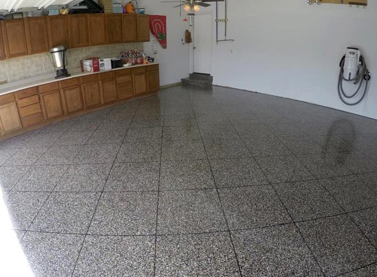 Faux tile done out of flake epoxy flooring in residential garage