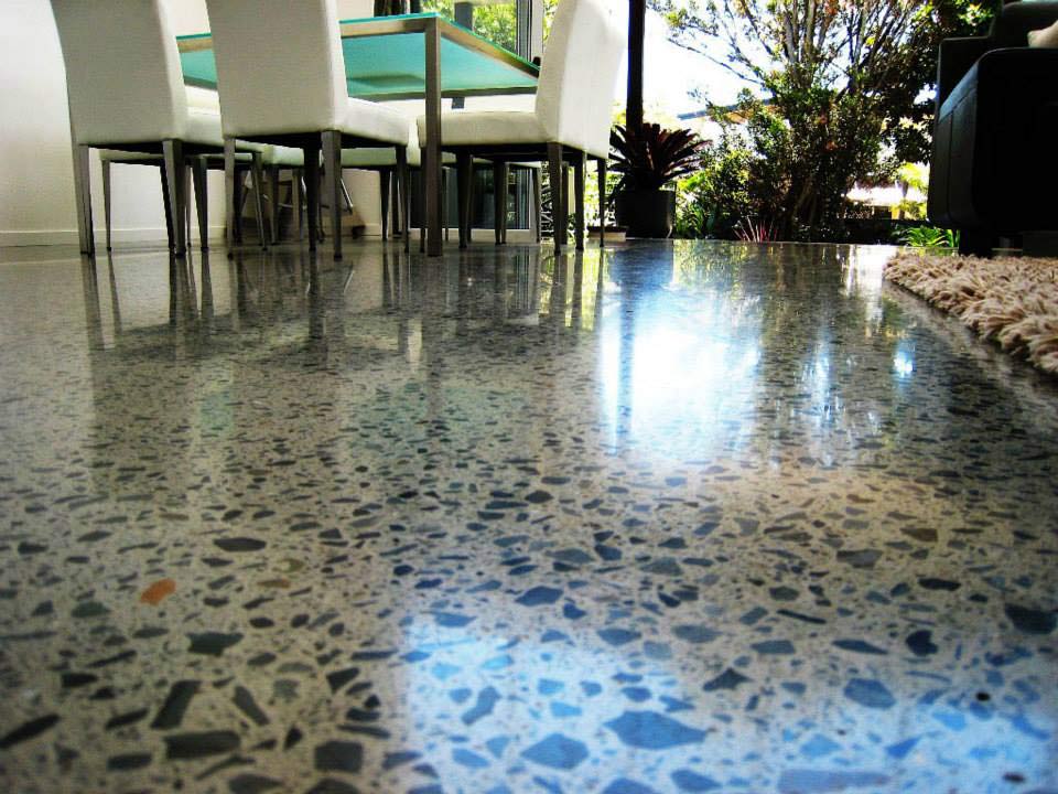 polished concrete with decorative embeds in hotel lobby