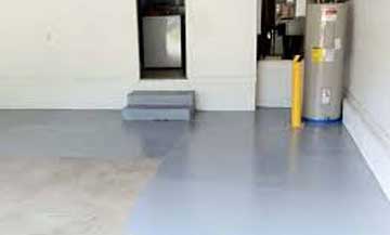 gray blue epoxy flooring on the stairs and floor of a residential garage
