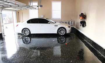 black epoxy with white flakes in a two car garage; fully cured.