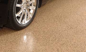 brown flake epoxy flooring in the garage of a residential home