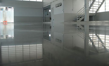white epoxy flooring in industrial warehouse