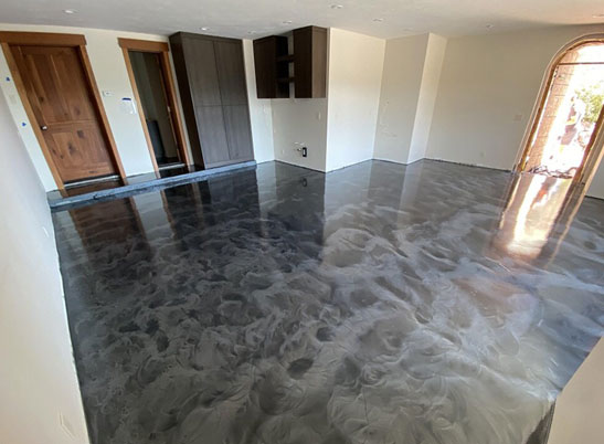 gray and white epoxy flooring in living room of residential home